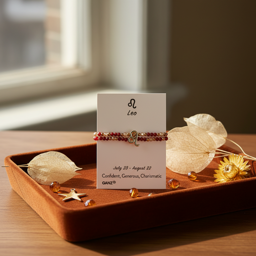 A Leo zodiac-themed beaded bracelet , displayed on a white card. The card is styled on a wooden tray with dried flowers and amber accents.