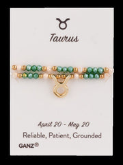 Taurus zodiac bracelet on a Ganz branded card with astrological details.