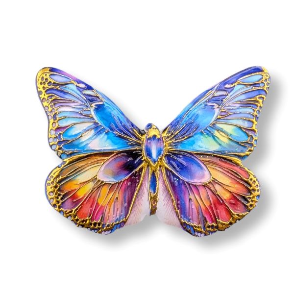Colorful butterfly-shaped object with gold accents on a white background