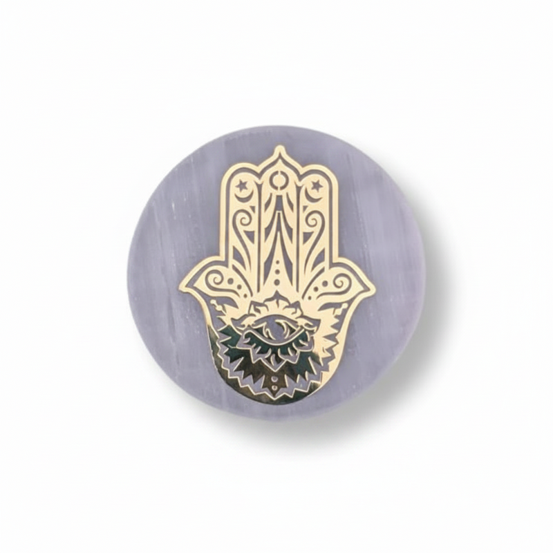 A selenite charge plate with a golden Hand Of Fatima, shown on a clean white studio background.