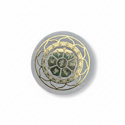 A Selenite Charge Plate with a golden Lotus Flower pattern, shown on a plain white background.