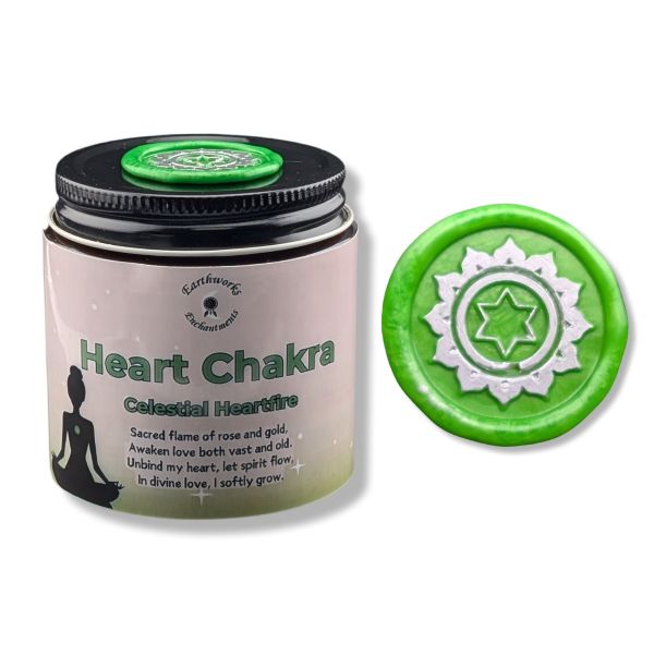 Candle jar labeled 'Heart Chakra' with green lid featuring a symbol, on a white background.