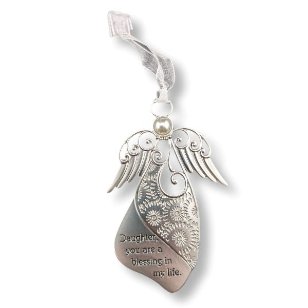 A silver metal angel ornament shaped like a winged heart pendant with floral engravings and the engraved text 'Daughter, you are a blessing in my life.' It hangs from a sheer white ribbon loop on a white background.