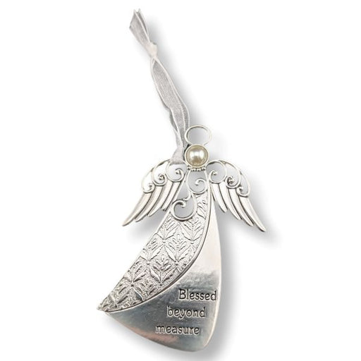 Silver angel-shaped ornament with engraved wings, a small pearl-like bead at the top, and the words 'Blessed beyond measure' on a white background.