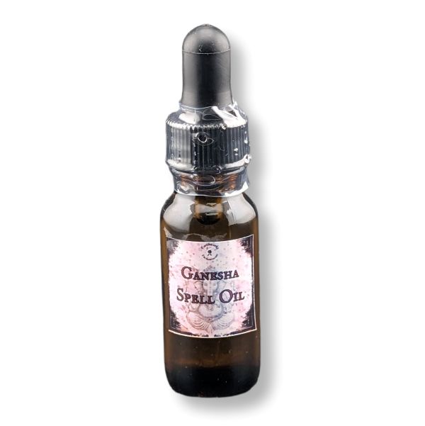 A small amber glass dropper bottle labeled 'Ganesha Spell Oil' with a black rubber dropper cap, shown on a plain white background.