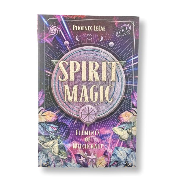 The book cover of 'Spirit Magic: Elements of Witchcraft' by Phoenix LeFae, featuring a mystical purple and blue design with a central circular emblem, stars, and illustrations of butterflies and flowers.