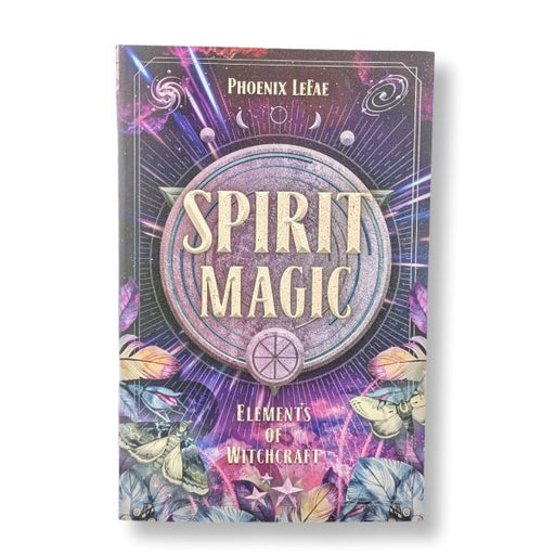 The book cover of 'Spirit Magic: Elements of Witchcraft' by Phoenix LeFae, featuring a mystical purple and blue design with a central circular emblem, stars, and illustrations of butterflies and flowers.