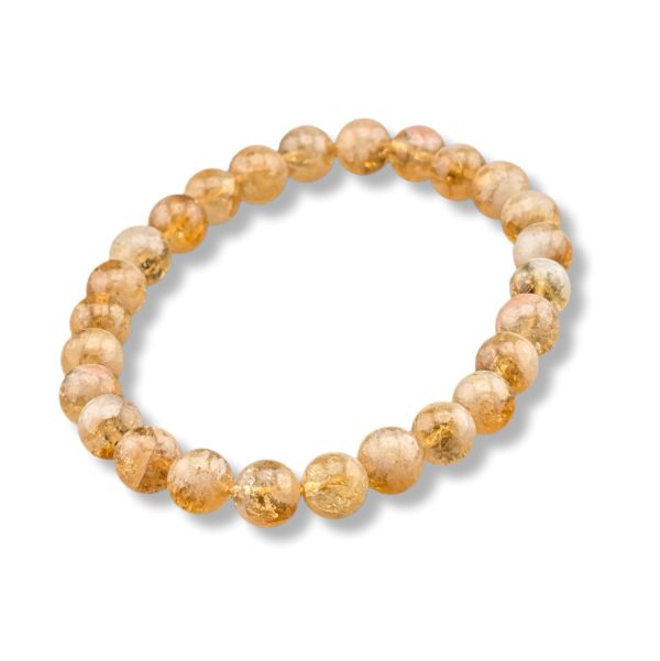 Beaded bracelet with yellow and beige stones on a white background