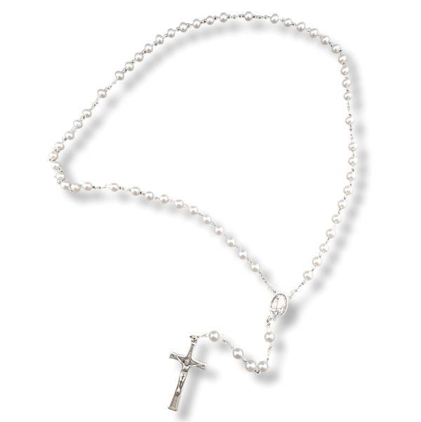 Pearl necklace with a silver cross pendant on a white background