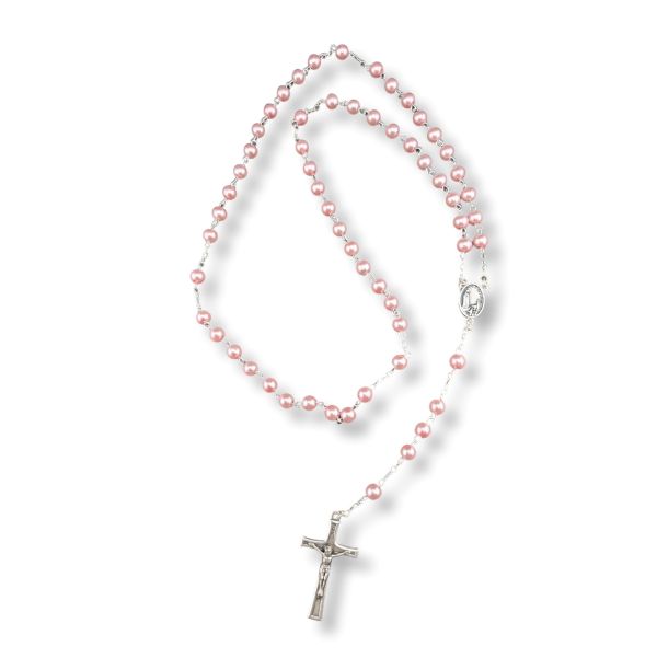 Pink pearl rosary with a silver cross on a white background