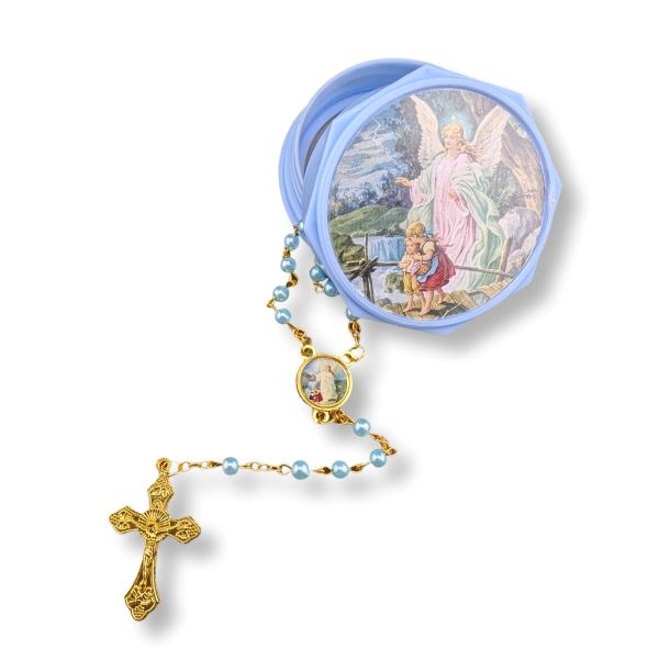 Rosary with gold cross and pearl beads in a decorative case on a white background