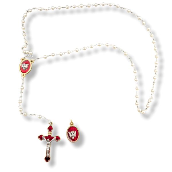 Pearl necklace with red and gold religious pendants on a white background