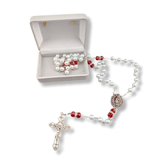 Rosary with white and red beads on a white background