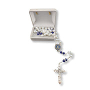Rosary with pearl and blue stone beads on a white background