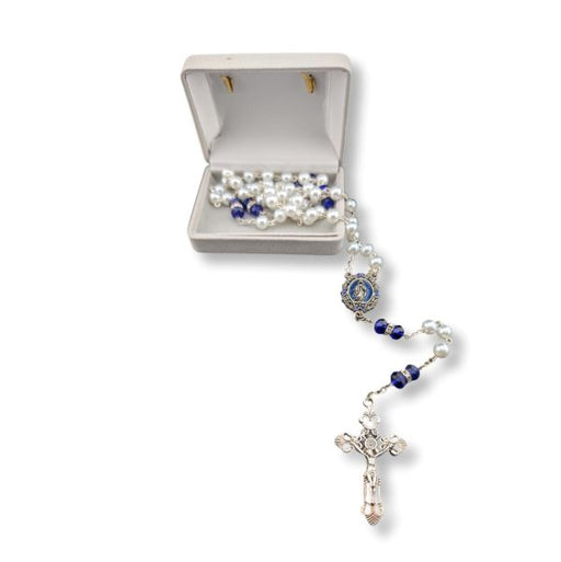 Rosary with pearl and blue stone beads on a white background