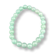 Mint green beaded bracelet on a white background