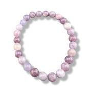 Pink and purple beaded bracelet on a white background