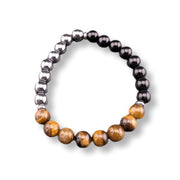 Beaded bracelet with hematite, black, and brown beads on a white background