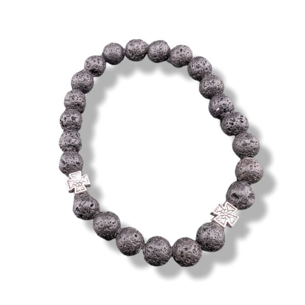 Lava stone bracelet with silver charms on a white background