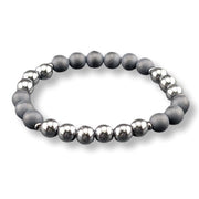 A beaded stretch bracelet featuring alternating matte dark gray and polished metallic silver beads, displayed on a clean white background.