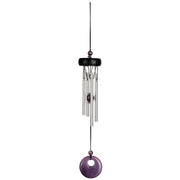 Decorative wind chime with purple accents on a white background
