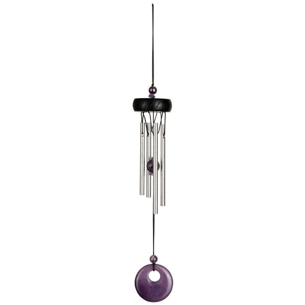 Decorative wind chime with purple accents on a white background
