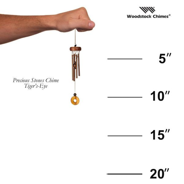 Woodstock Chimes wind chime with measurement scale on a white background