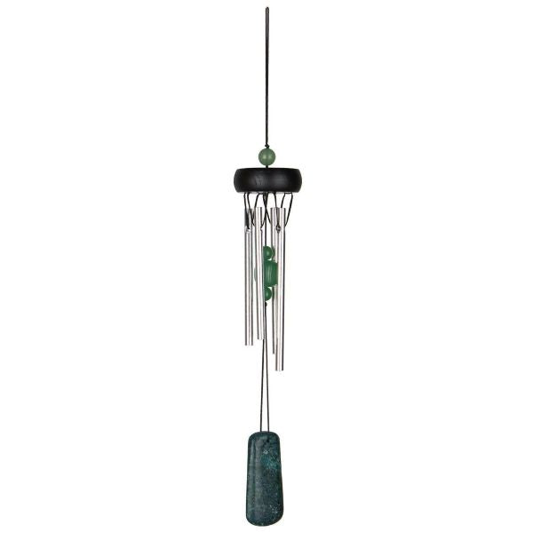 Decorative wind chime with green accents on a white background