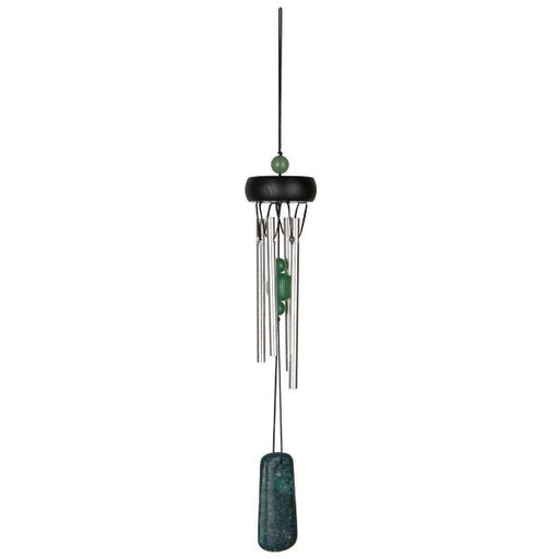 Decorative wind chime with green accents on a white background