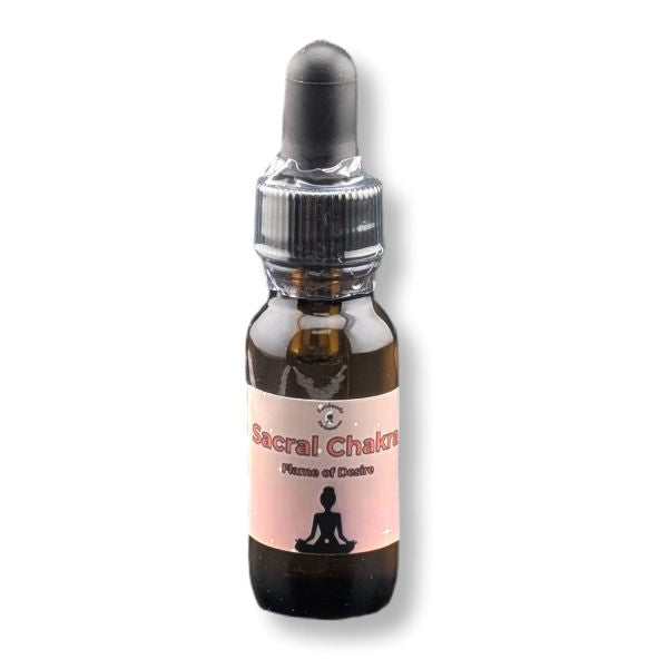 Bottle of 'Sacral Chakra' oil with a pink label on a white background