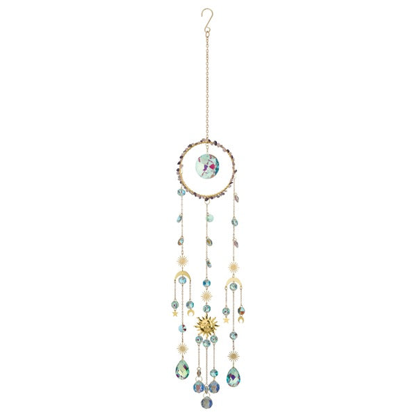 Decorative hanging mobile with beads and celestial elements on a white background