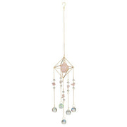 Decorative hanging crystal with pink stone and beads on a white background
