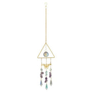 Decorative hanging crystal with geometric design on a white background