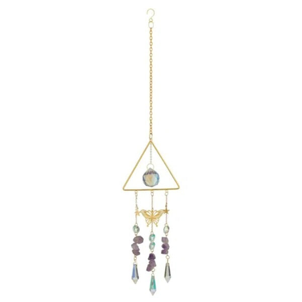 Decorative hanging crystal with geometric design on a white background