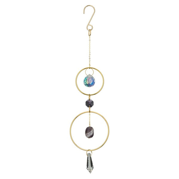 Decorative hanging ornament with gold loops, stones, and a crystal on a white background