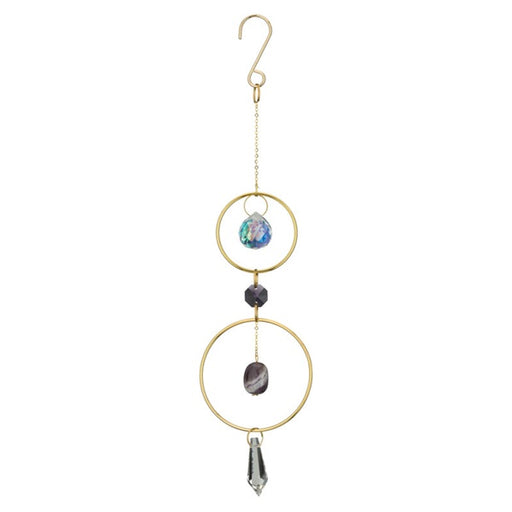 Decorative hanging ornament with gold loops, stones, and a crystal on a white background