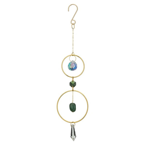 Decorative hanging ornament with gold rings, green bead, and crystal on a white background
