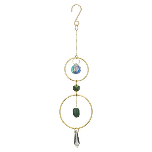 Decorative hanging ornament with gold rings, green bead, and crystal on a white background