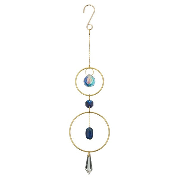 Decorative hanging ornament with gold rings, blue beads, and a crystal on a white background