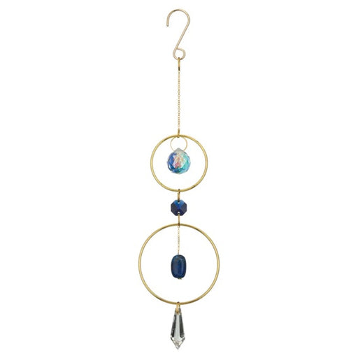 Decorative hanging ornament with gold rings, blue beads, and a crystal on a white background