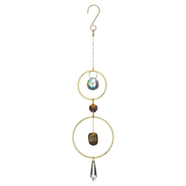 Decorative hanging ornament with gold rings, crystal, and stone on a white background