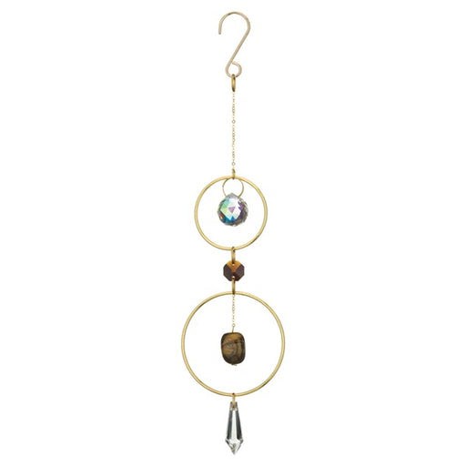 Decorative hanging ornament with gold rings, crystal, and stone on a white background