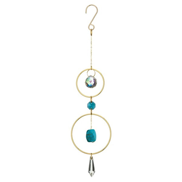 Decorative hanging ornament with gold rings, turquoise beads, and crystal accents on a white background