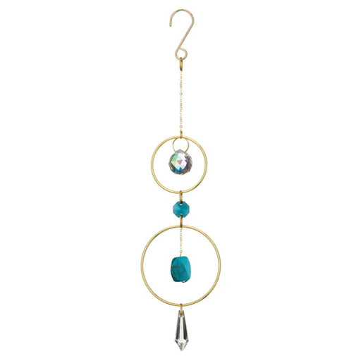 Decorative hanging ornament with gold rings, turquoise beads, and crystal accents on a white background