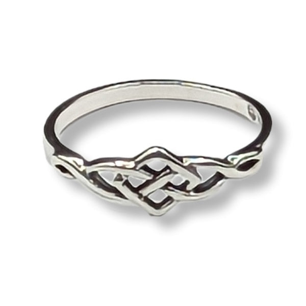 Silver ring with intricate design on a white background