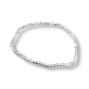 A delicate labradorite faceted bracelet with clear faceted crystals, arranged in an oval shape on a white background with a soft drop shadow.
