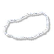 A beaded stretch necklace made of small, round white beads with subtle light blue marbling, displayed on a clean white background with a soft drop shadow.