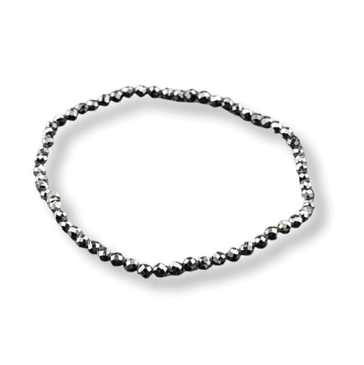 A single beaded bracelet made of small faceted dark metallic beads, arranged in an oval shape on a clean white background.