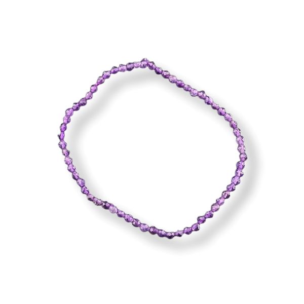 A single beaded bracelet made of small faceted purple beads, arranged in a loose circle on a clean white background.