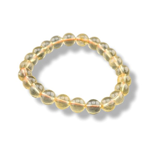 A beaded stretch bracelet made of translucent light yellow gemstone beads, arranged in a circle on a white background with a soft drop shadow.